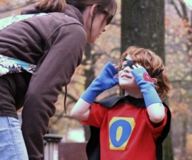 mom talking to superhero son