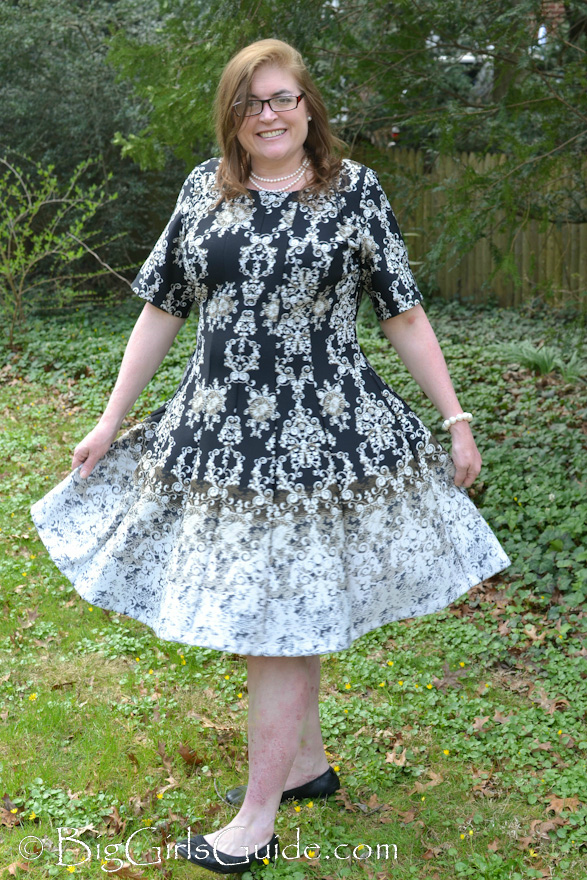 Plus size blogger over 40 fun dress great for a wedding or church